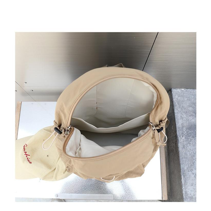 IELGY Korean version of casual literary canvas schoolbag, pleated nylon drawstring backpack, fashionable Oxford cloth backpack.