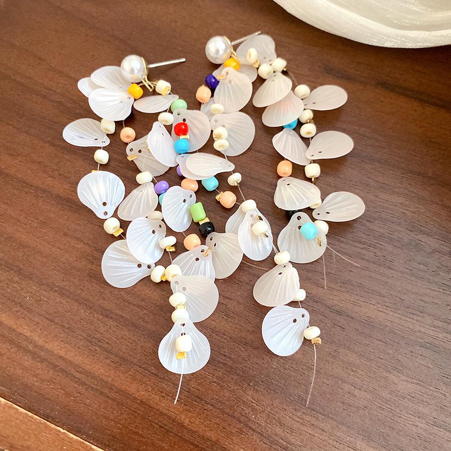 

Seaside vacation wind silver needle shell pearl fringed earrings, high-end exaggerated earrings, unique and beautiful temperament earrings