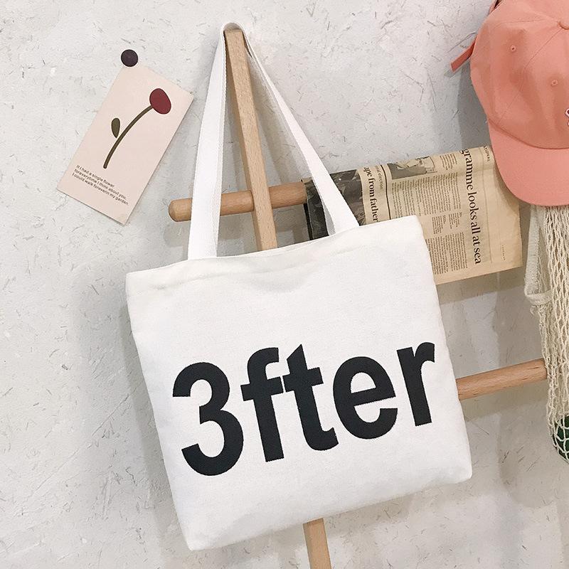Letter literary shoulder bag, student make-up bag, large-capacity canvas bag, women's shopping bag, wind handbag.