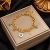 Gold Tone Double Layer Evil Eye Charm Bracelet with Turquoise Accents