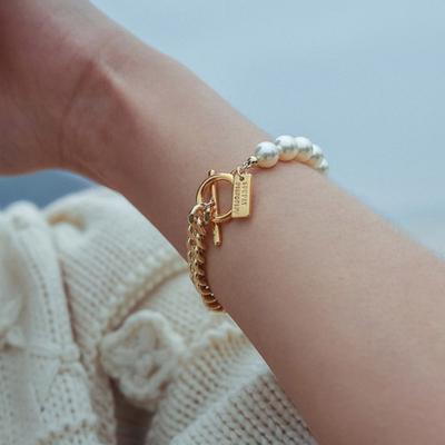 SÖNDAGS DISCOKLUBB PÄRLA HALV KEDJA armband GULD