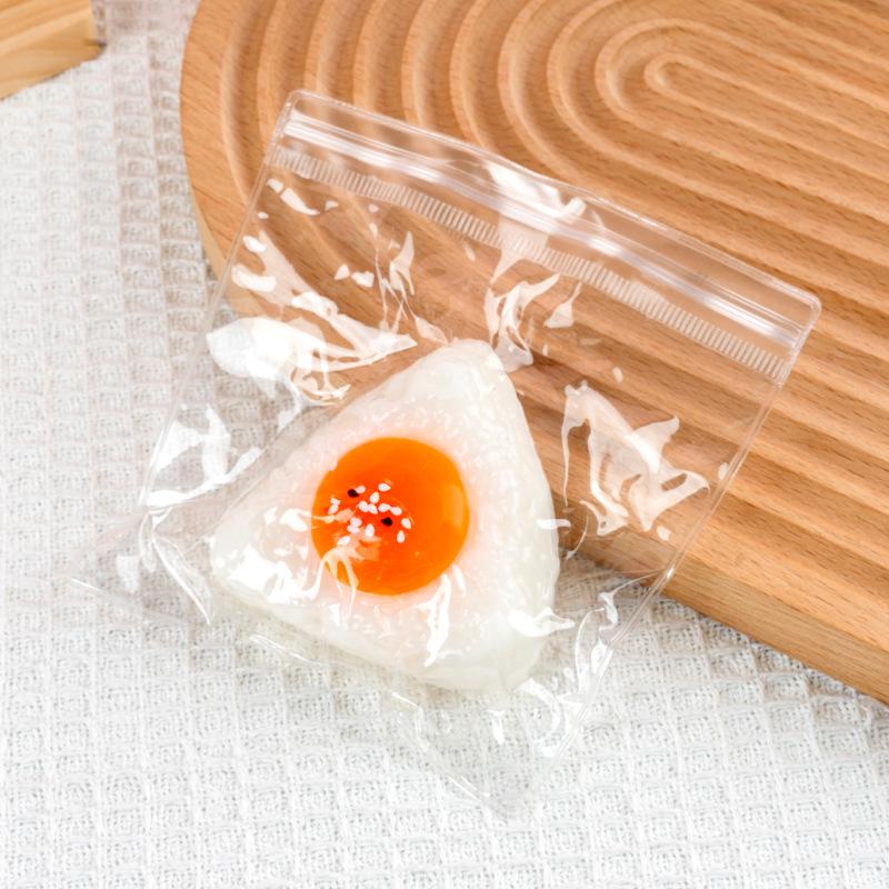 

Игрушка-сквиши в виде рисового шарика с желтком - Креативный подарок для снятия стресса для студентов