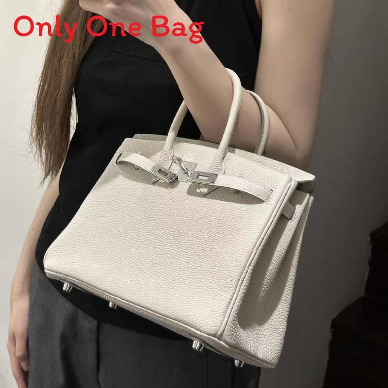 Leather Handbag With Silver Lock For Elegant Women Day Use