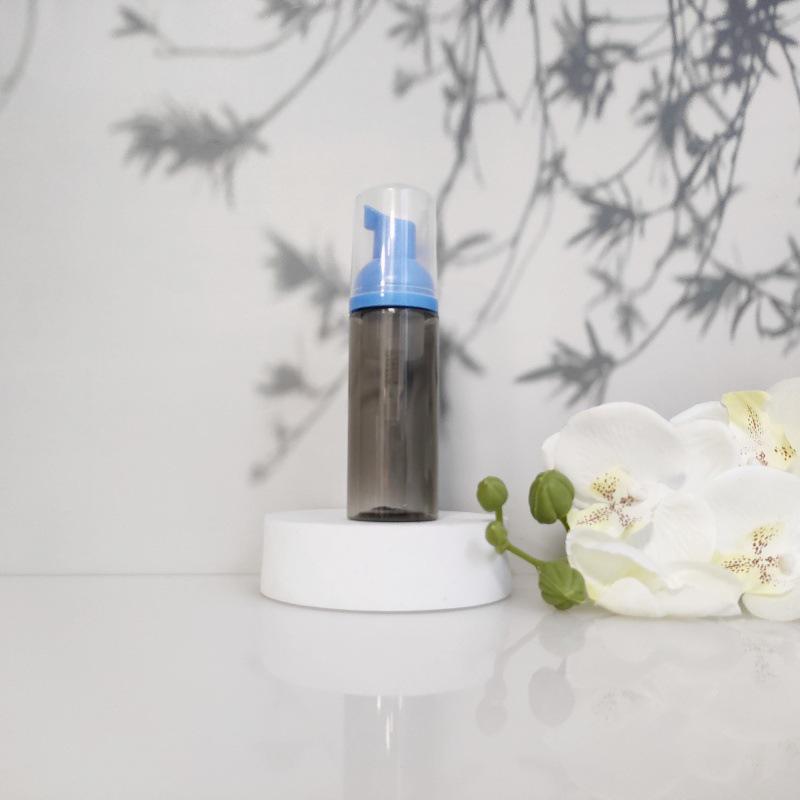 Available 60ml Transparent Black Foam Mousse Bottle for Face Wash and Travel-friendly Cosmetic Packaging.