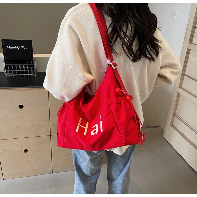Tote bag women's 2024 new large-capacity commuting letter foreign feeling college students commute to class shoulder backpack