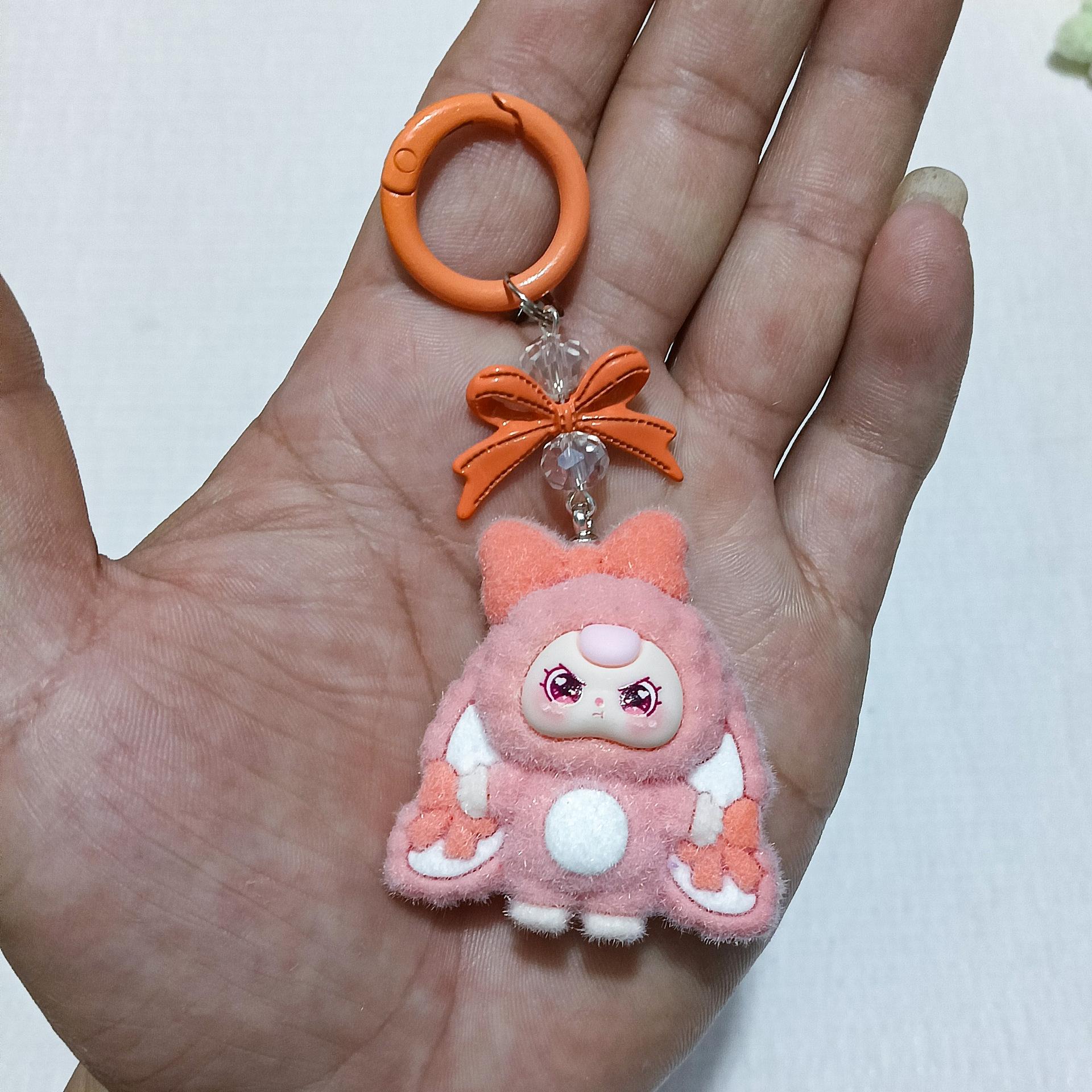 

3 Year Old Cute Doll Keychain With Droopy Ears And Bow One Size