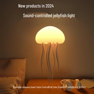 Lampada medusa smart a controllo vocale con gradiente colorato e tentacoli vivaci, batteria integrata, atmosfera da luce notturna.