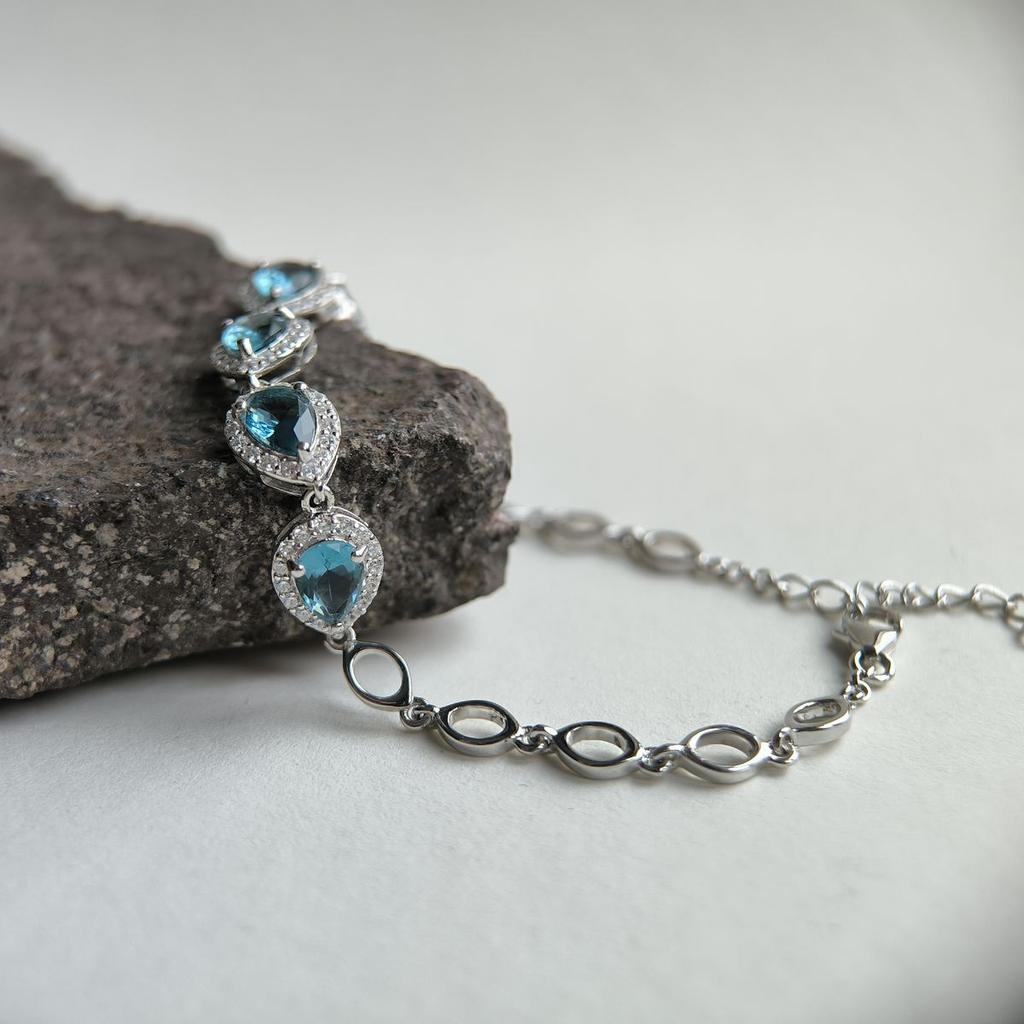 Серебряный браслет с топазом Лондон Блю, вес изделия 6,08 гр (2181675)