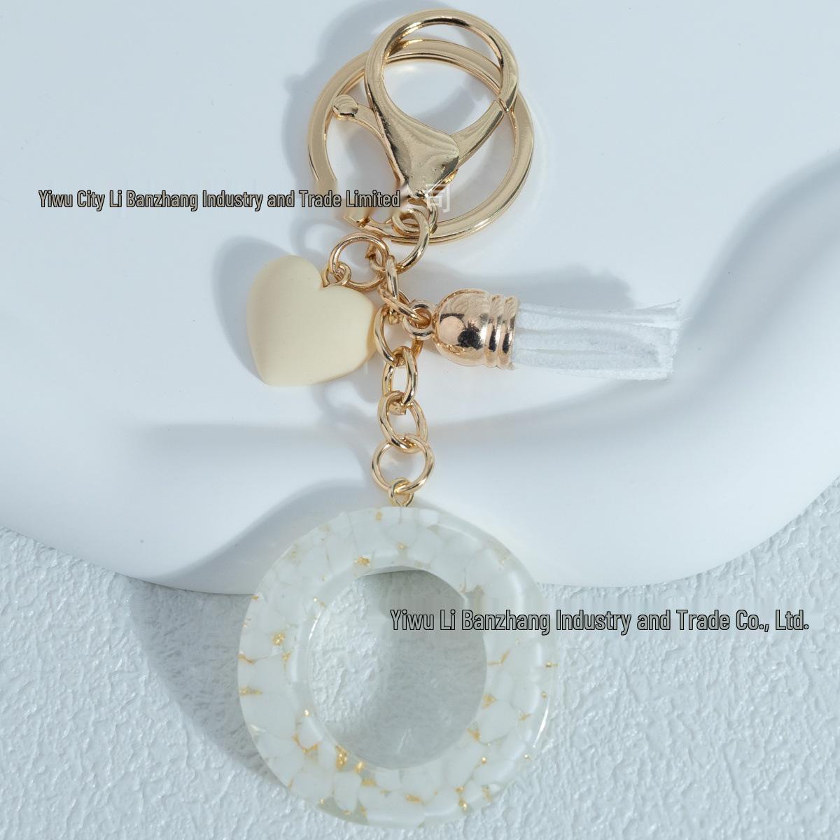 

White Stone Alphabet Keychains with Peach Heart Tassel Pendants – 26 Letters, Perfect for Ladies Bags