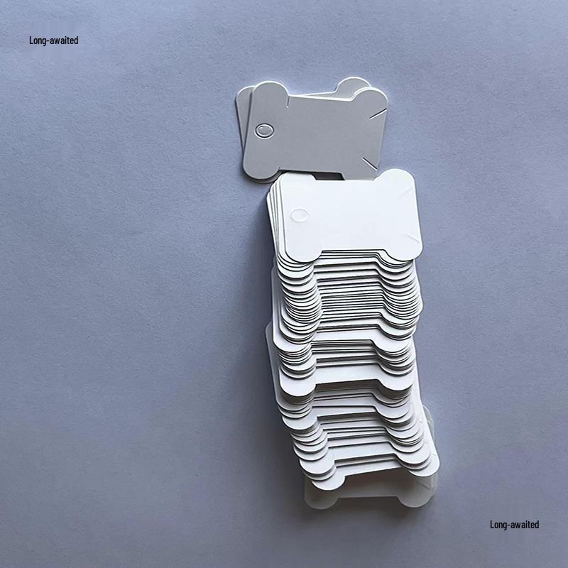 White Paper Thread Bobbins for Cross Stitch Organizing