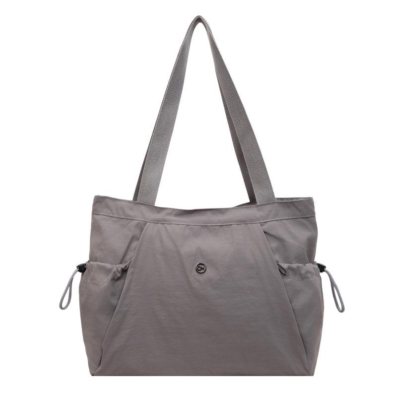 

Casual nylon bag female large-capacity student class hand-held canvas bag simple and versatile commuter shoulder tote bag серый
