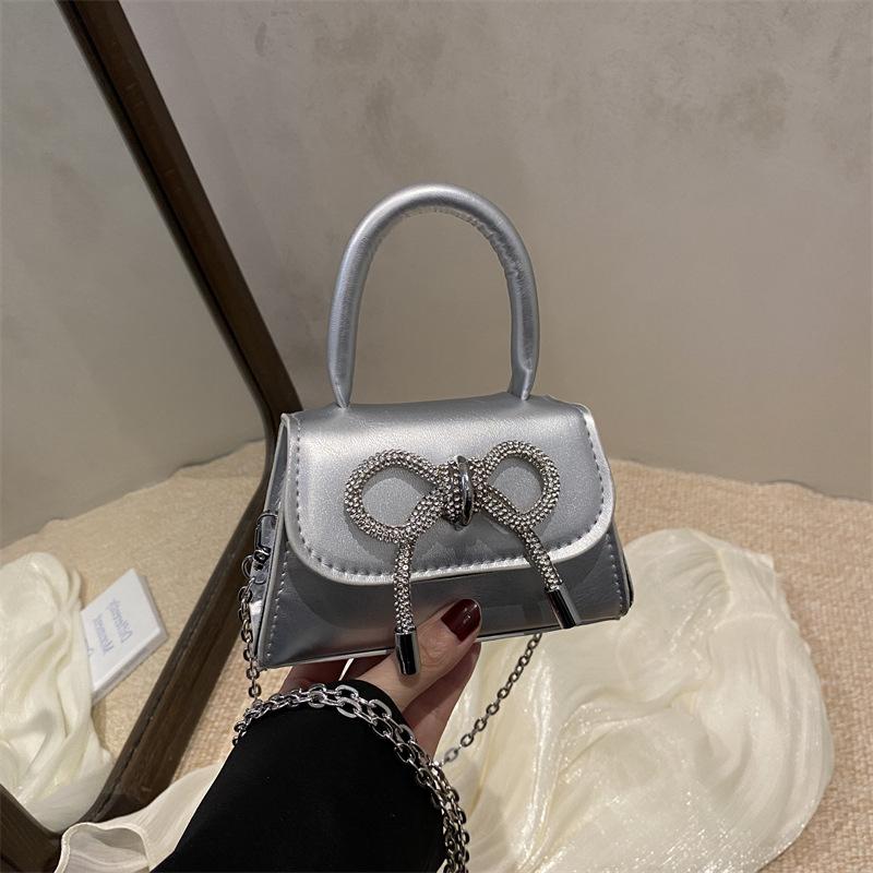 2026 Fashi Women's Mini PU Leather Handbag with Metal Chain Strap&Oversized Bow Top Handle Crossbody Bag for Decorative Purse