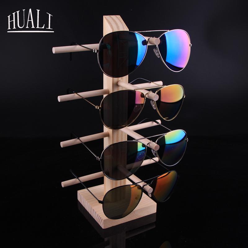 Stojak podłogowy z litego drewna na oprawki okularów i okulary przeciwsłoneczne