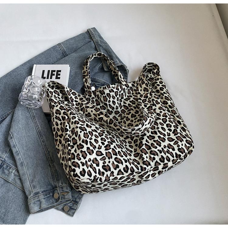 

Niche leopard print canvas tote bag women s bag casual large capacity fashion handbag Korean version foreign style shoulder messenger bag