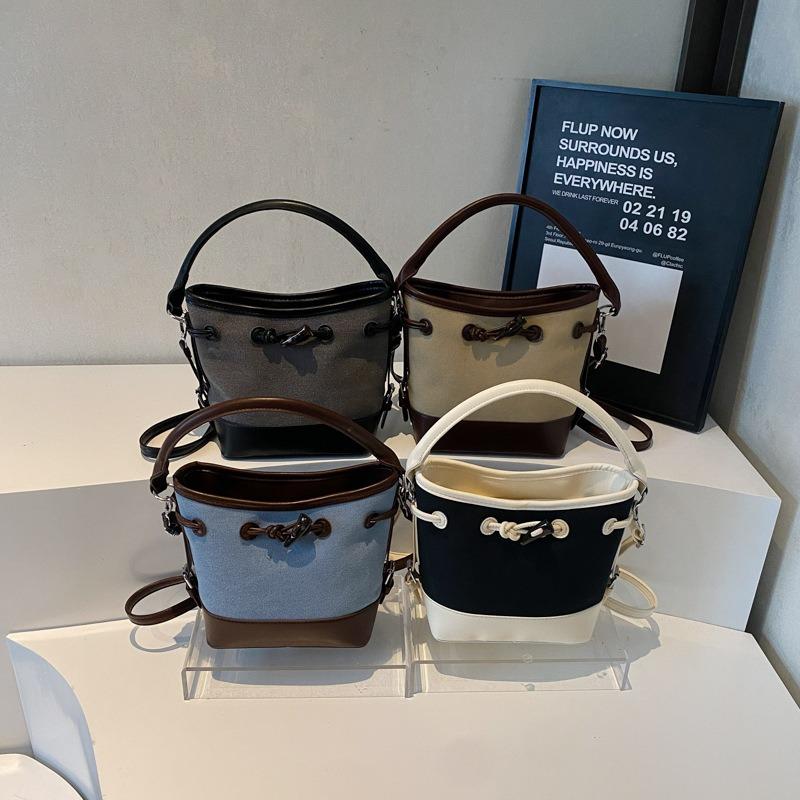 Niche design canvas splicing contrasting color bucket bag women's new portable commuter bag shoulder messenger bag