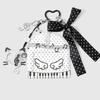 Trendy Musical Note Keyring Key Holder Featuring Piano Keys And Delicate Bowknot Perfect For Music Enthusiasts