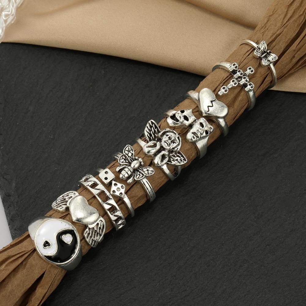 Set di anelli di gioielli intagliati con croce di scheletro di Tai Chi con farfalla di angelo dell'amore da 10 pezzi