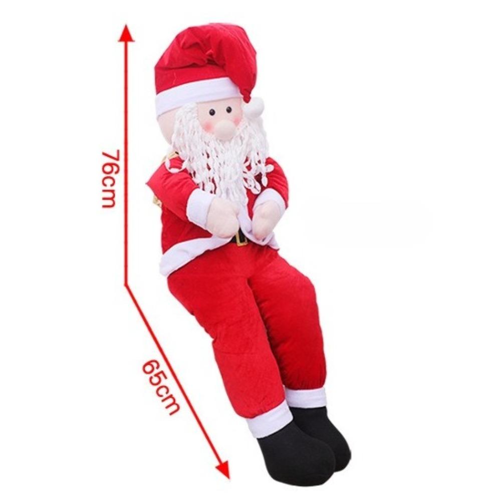 Rekwizyty Świętego Mikołaja, wózek z reniferami w pozycji siedzącej, Święty Mikołaj niosący paczkę z prezentami, świąteczna dekoracja okienna scena