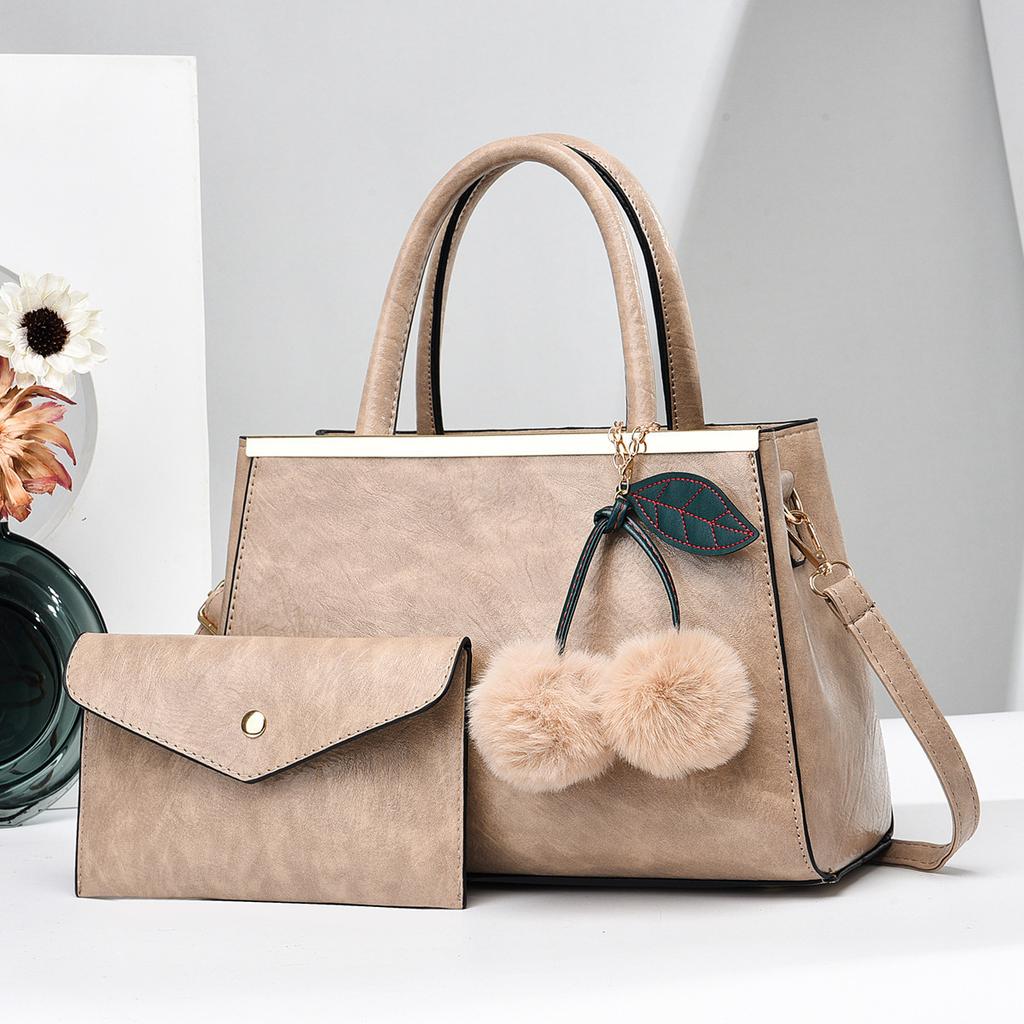 Einfache Elegante Damenhandtasche und Geldbörsen Neue Große Kapazität Fellbommel Anhänger Schultertasche High End Damen Umhängetaschen