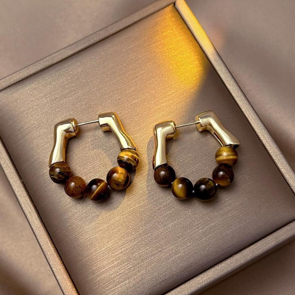 Silver Needle Tiger's Eye Style Earrings: Elegant, Fashionable Studs with Caramel Color Finish.