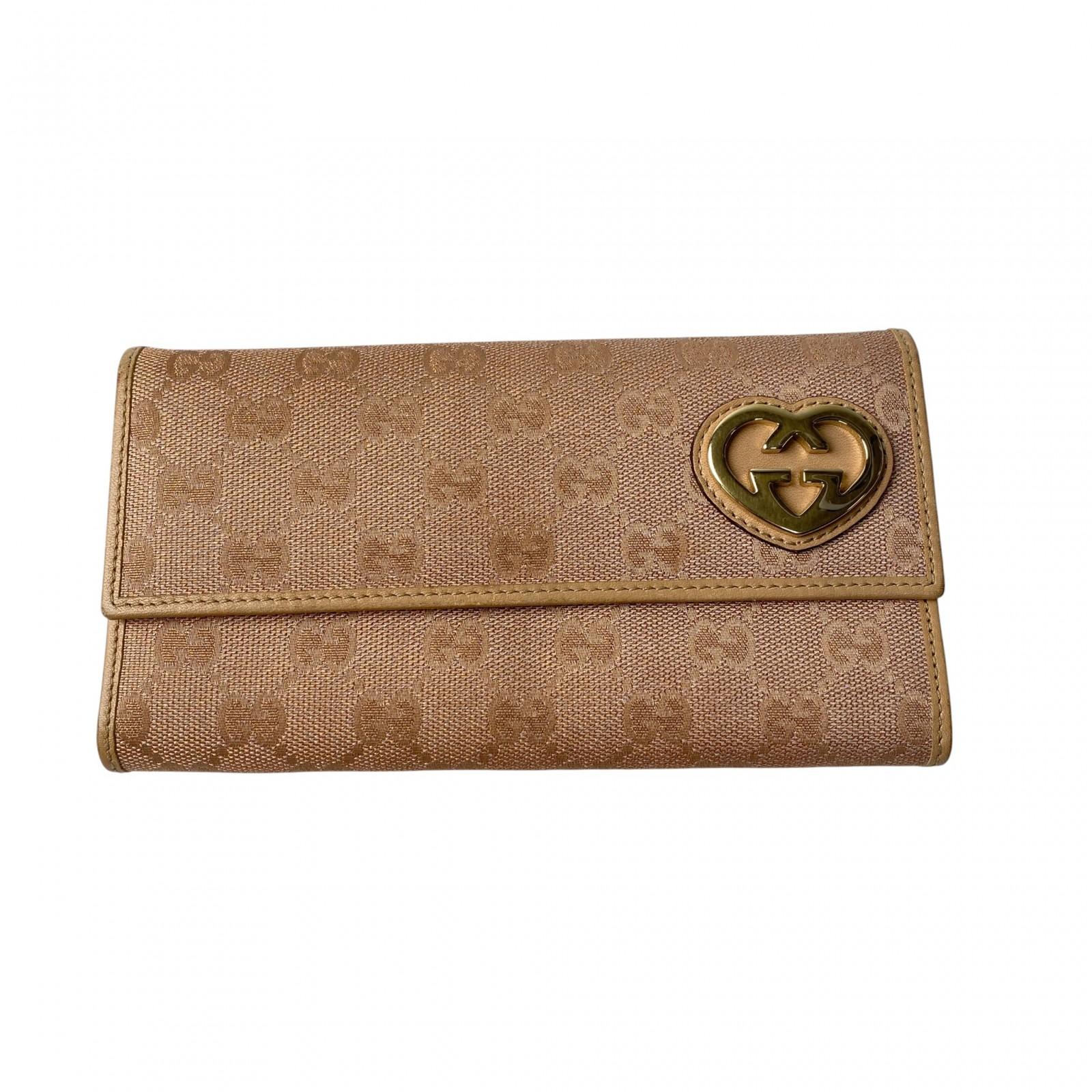 

Вживана гаманець GUCCI рожевий полотно/шкіра Жіночий