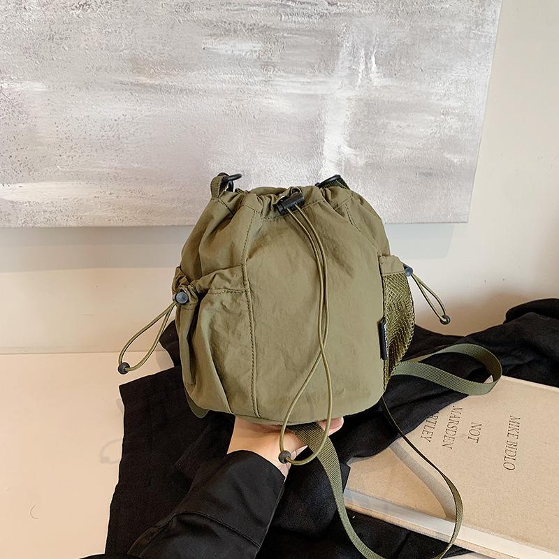 Niche Design Nylon Bucket Bag Women's 2026 Spring New Fashion Super Fire Drawstring Shoulder Messenger Bag