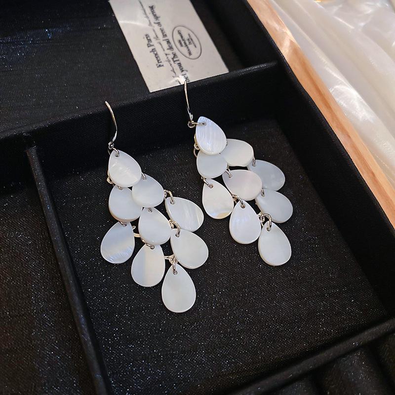 Silver Needle White Heart Tassel Earrings: Luxurious, Versatile, and Stylish Stud Earrings for Women.