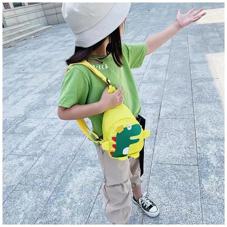 Borsa a tracolla per bambini con stampa di dinosauri, simpatico marsupio a cartoni animati per ragazzi e ragazze, borsa a tracolla leggera per l'uso quotidiano