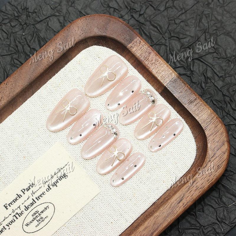 Magic Mirror Bow: Handmade Pink Cat Eye Nail Art with Sweet Heart Design