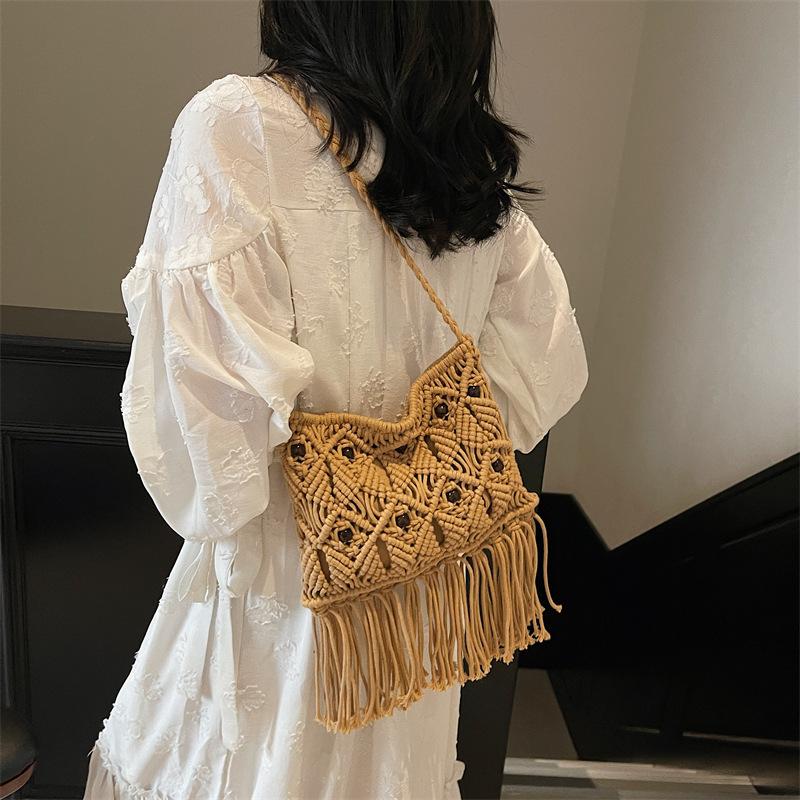 

Woven bag women s 2025 new line fashion shoulder bag fringed messenger bag bucket bag