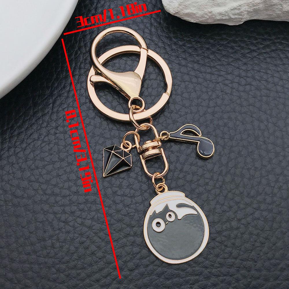 Well-Behaved Black Cat Zinc Alloy Keychain: Cute Drip Oil Cartoon Pendant for Backpacks