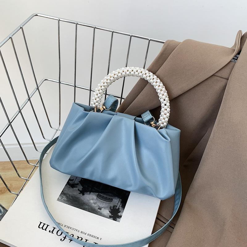 Solid color women's bag, summer new cloud bag, fashionable softfaced portable small bag, simple foreign style single shoulder oblique span bag