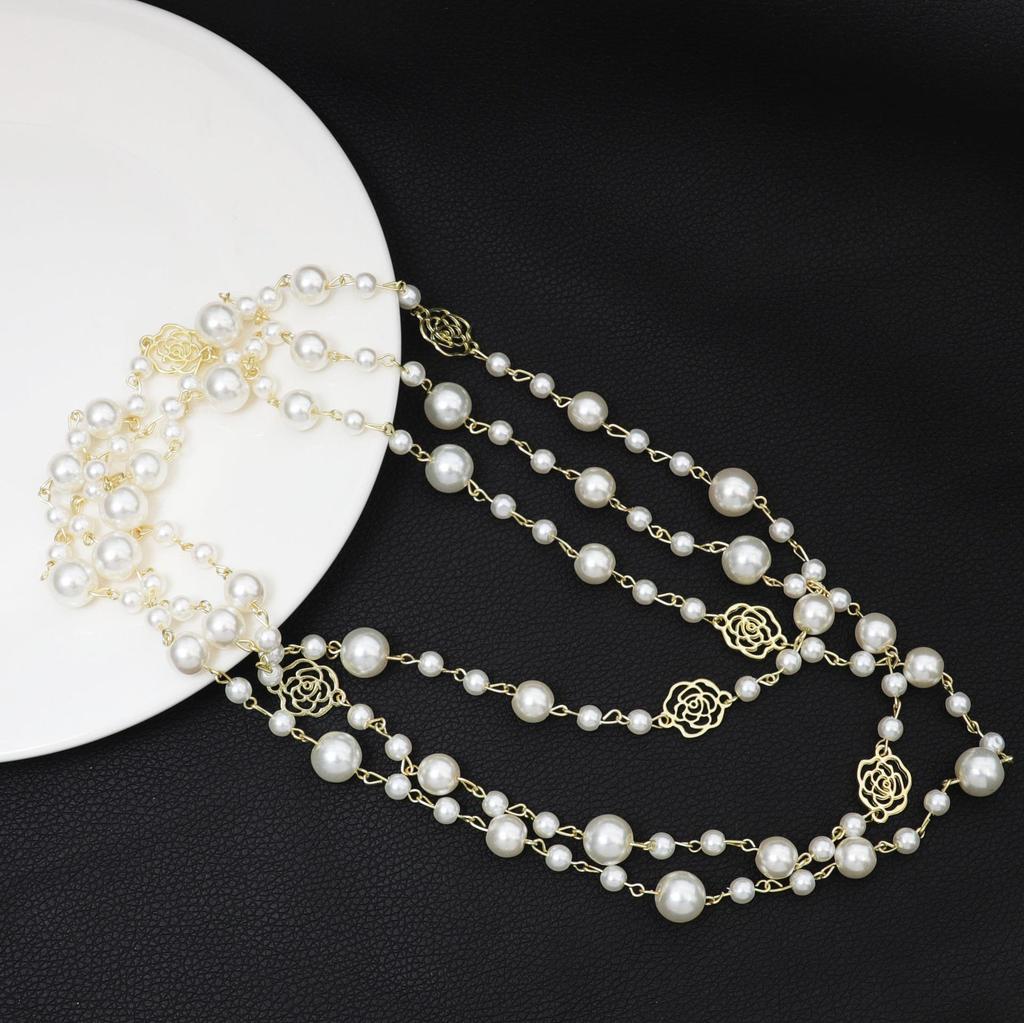 Korean Long Pearl Necklace: Trendy Multi-layer Hollow Flower Sweater Chain for Women
