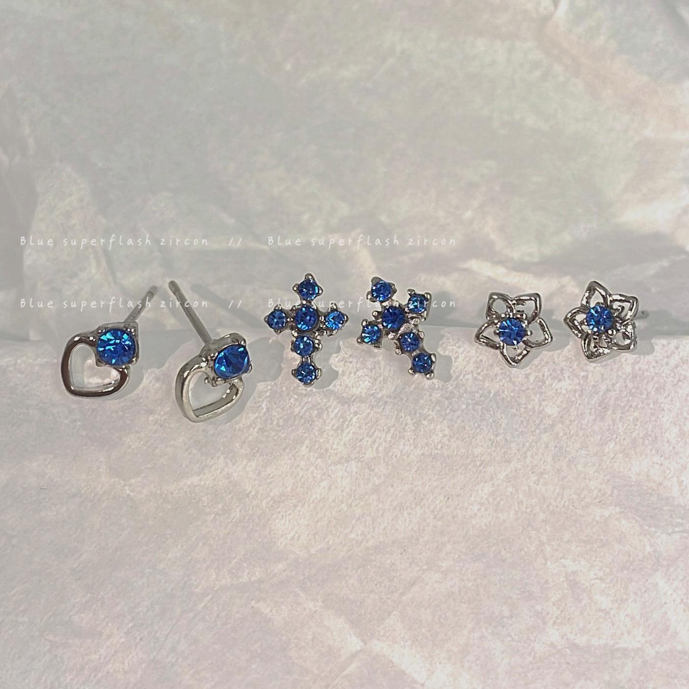 

Elegant Cross Sea Blue Diamond Earrings for Women with Silver Needle and Niche Design