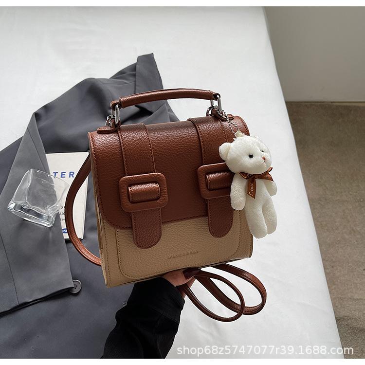 

Premium texture foreign style Cambridge bag women s 2025 new college style contrasting color backpack commuter shoulder messenger bag коричневый