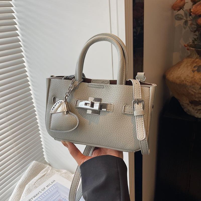 Premium Sense Hand Trage Tasche Damen Neue Mode Einfache Schulter Umhängetasche Nische Pendler Tasche