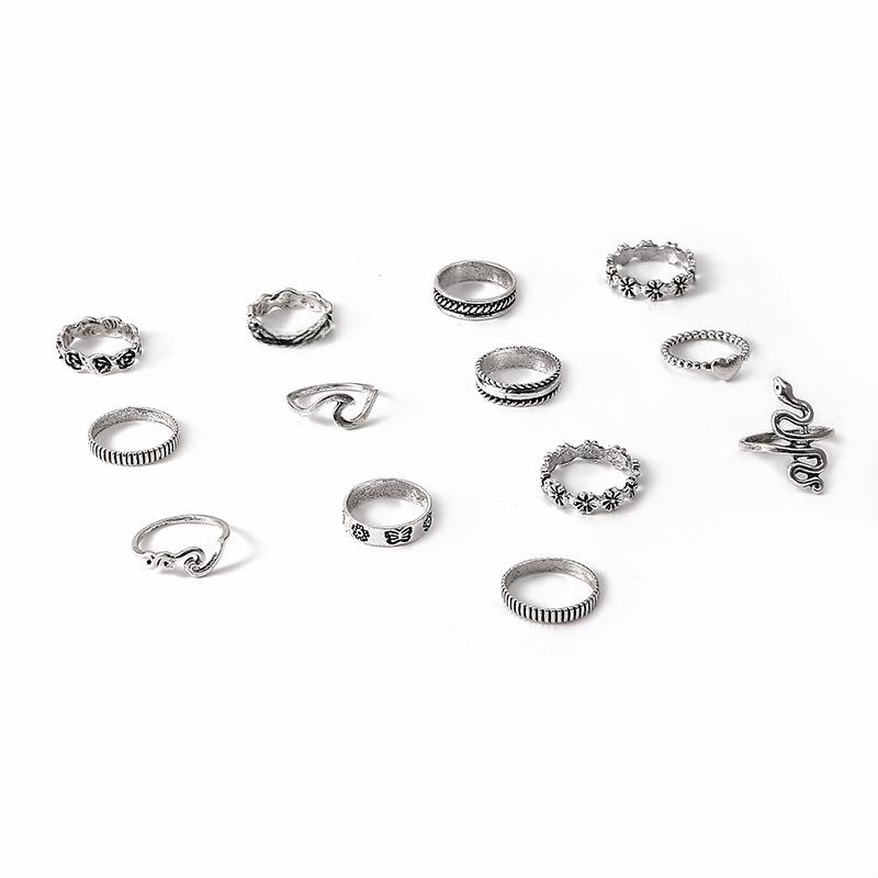 Grenzüberschreitender beliebter Schmuck: Dreizehnteiliges Ringset mit Schlangen-, Blumen-, Liebes- und geometrischem Design.