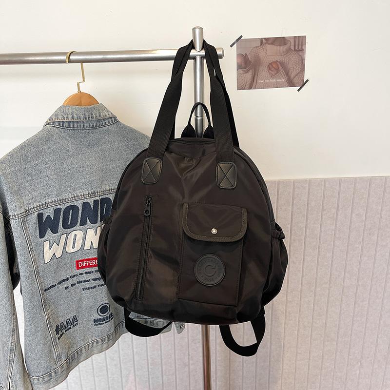 

2025 новый осенне-зимний простой и универсальный рюкзак большой вместимости, рюкзак для деловой поездки, портативная наплечная сумка, школьный рюкзак, тренд чёрный