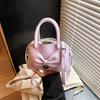 Niche bow small bag women's new hand bucket bag spring and summer retro shoulder messenger bag