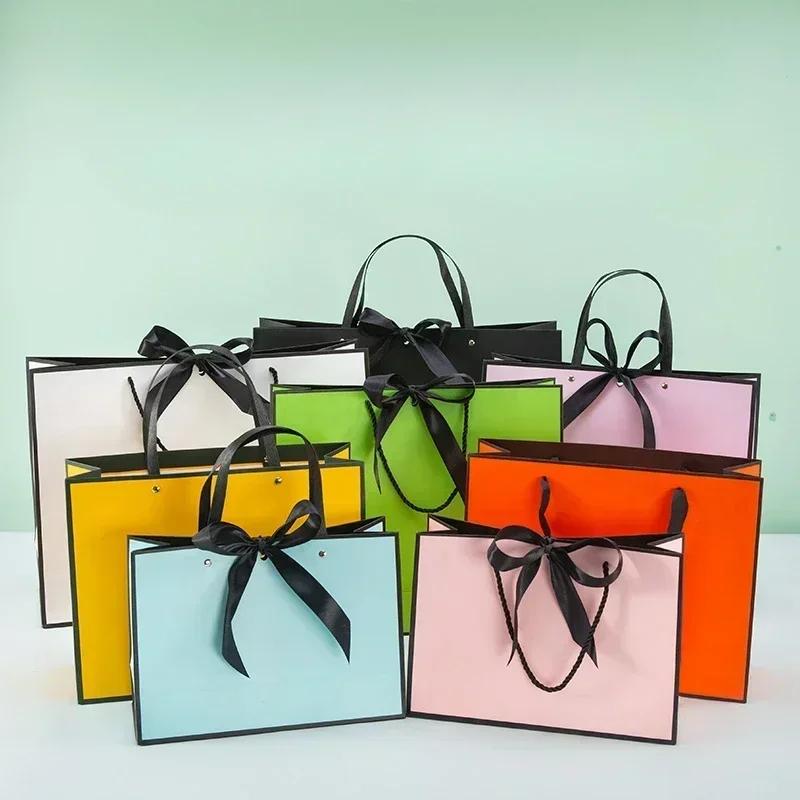 White Paper Jam Handbag Kraft Paper Thick Waterproof Frame Rivet Handle Gift Bag Cosmetic Clothing Store Portable Packaging Bags