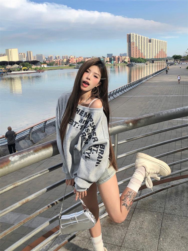 American-Style Oversized Off-Shoulder Sweater: Letter Print, Long Sleeve, Casual Loose Fit for Women In Early Autumn.