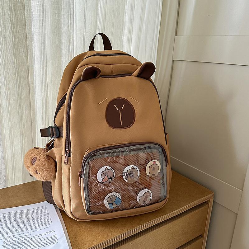 Summer new cute girl burden protection light backpack girl junior high and high school student large capacity backpack girl single bag will send a badge. коричневый