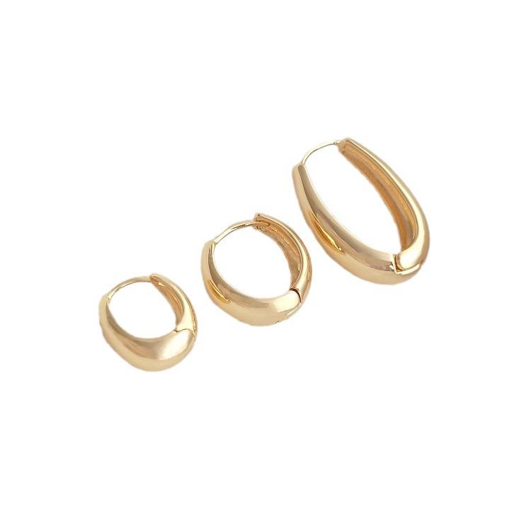 Nausznice w kształcie łezki wypełnione 14-karatowym złotem: Eleganckie, zachowujące kolor kolczyki damskie o luksusowym, prostym i modnym designie.