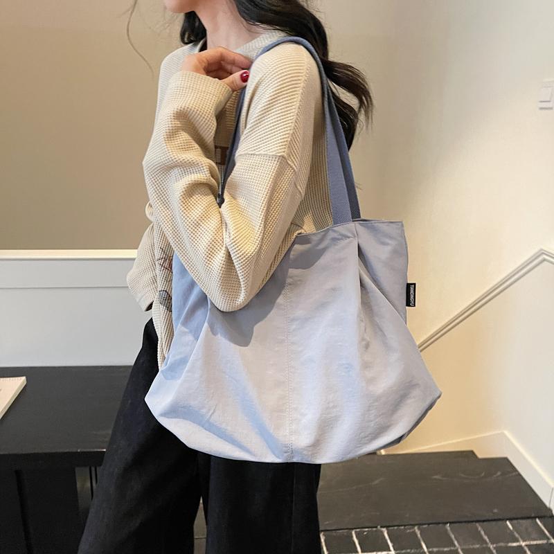 Minimalist Nylon Tote Bag with Spacious Design and Durable Handles Perfect for Everyday Use and Shopping