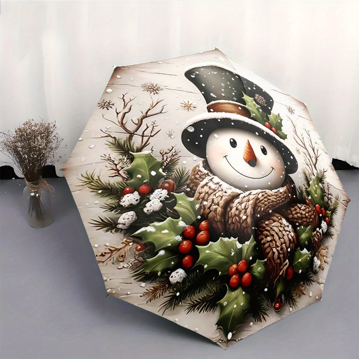 

Automatic Folding Umbrella Snowman with a top hat, scarf, and holly leaves. Portable collapsible design, casual outdoor access