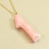 Undyed pink garnet coral branch pendant necklace.