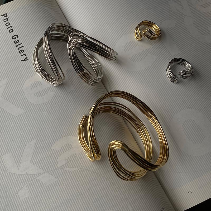High-End European & American Metal Twist Open Bangle: Fashionable Cold Style Bracelet with Unique Personality