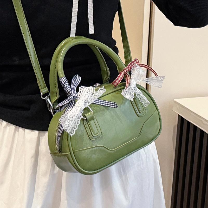 Frühling 2025 neu Ou Ruofeng Koreanische Version von einfacher tragbarer Boston-Tasche Nische lässig vielseitige Umhängetasche Tasche Damen