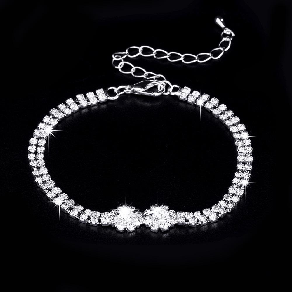 

Комплект свадебных украшений из трех предметов со стразами и цирконами: Колье-капля, серьги и браслет