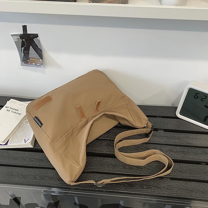 

Crossbody bag male ISN trendy brand large-capacity messenger bag female simple and lightweight shoulder bag college student class bag коричневый